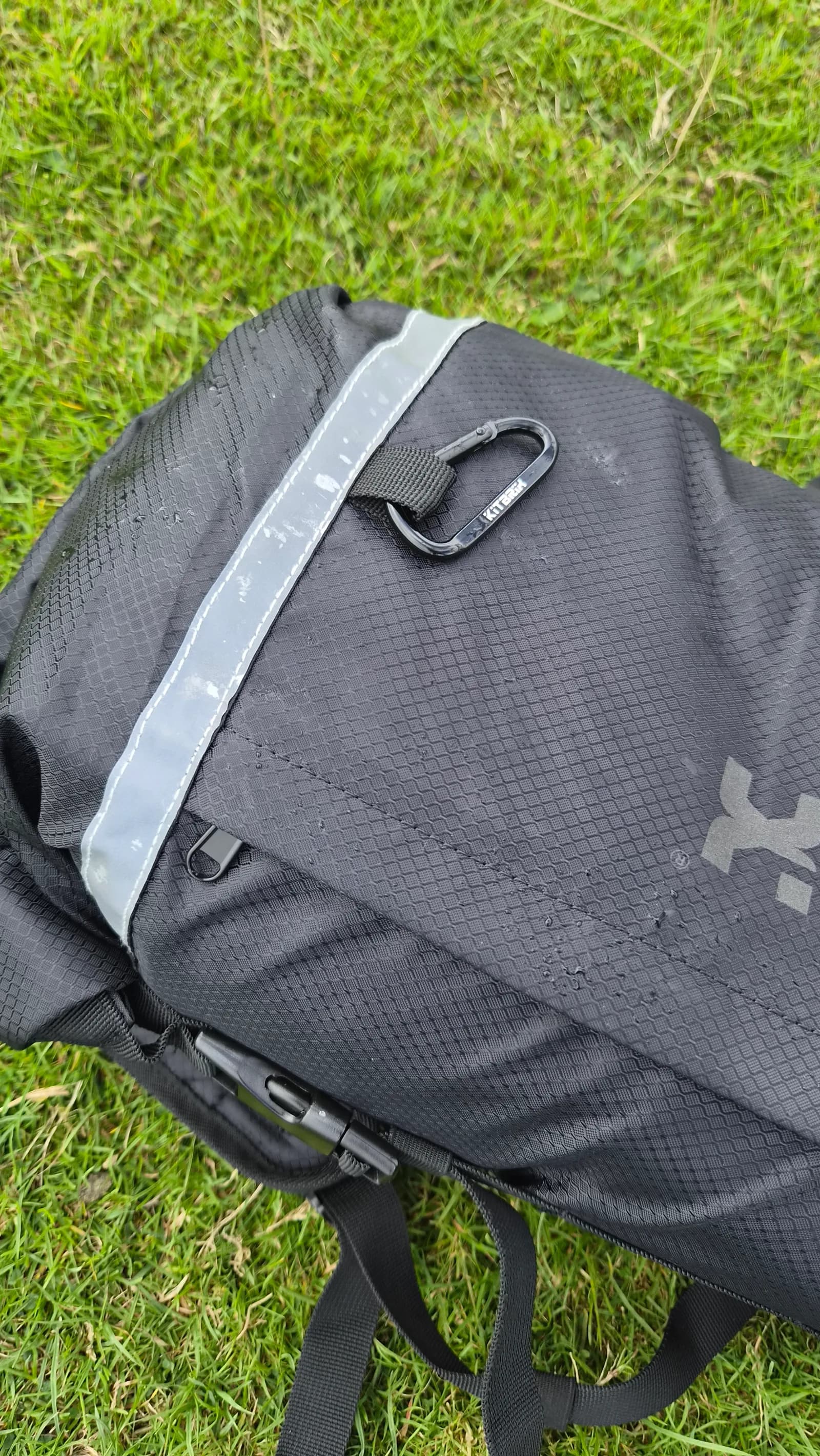 The carabiner and reflective detailing on the front of the PoKit